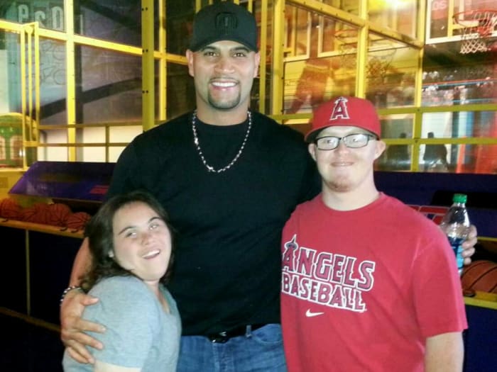 Albert Pujols with Alex Tuchowski (left) and her friend Nate at ESPN Zone